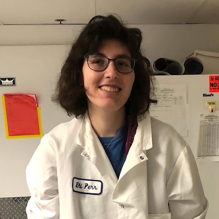 Eli Perr wearing a lab coat